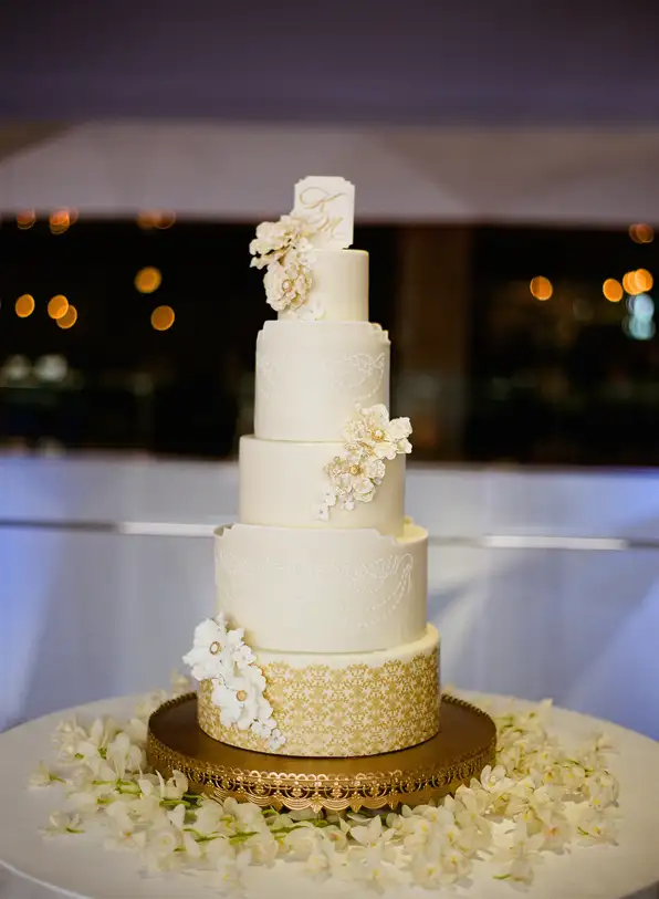A premium white wedding cake with elegant layered decoration.