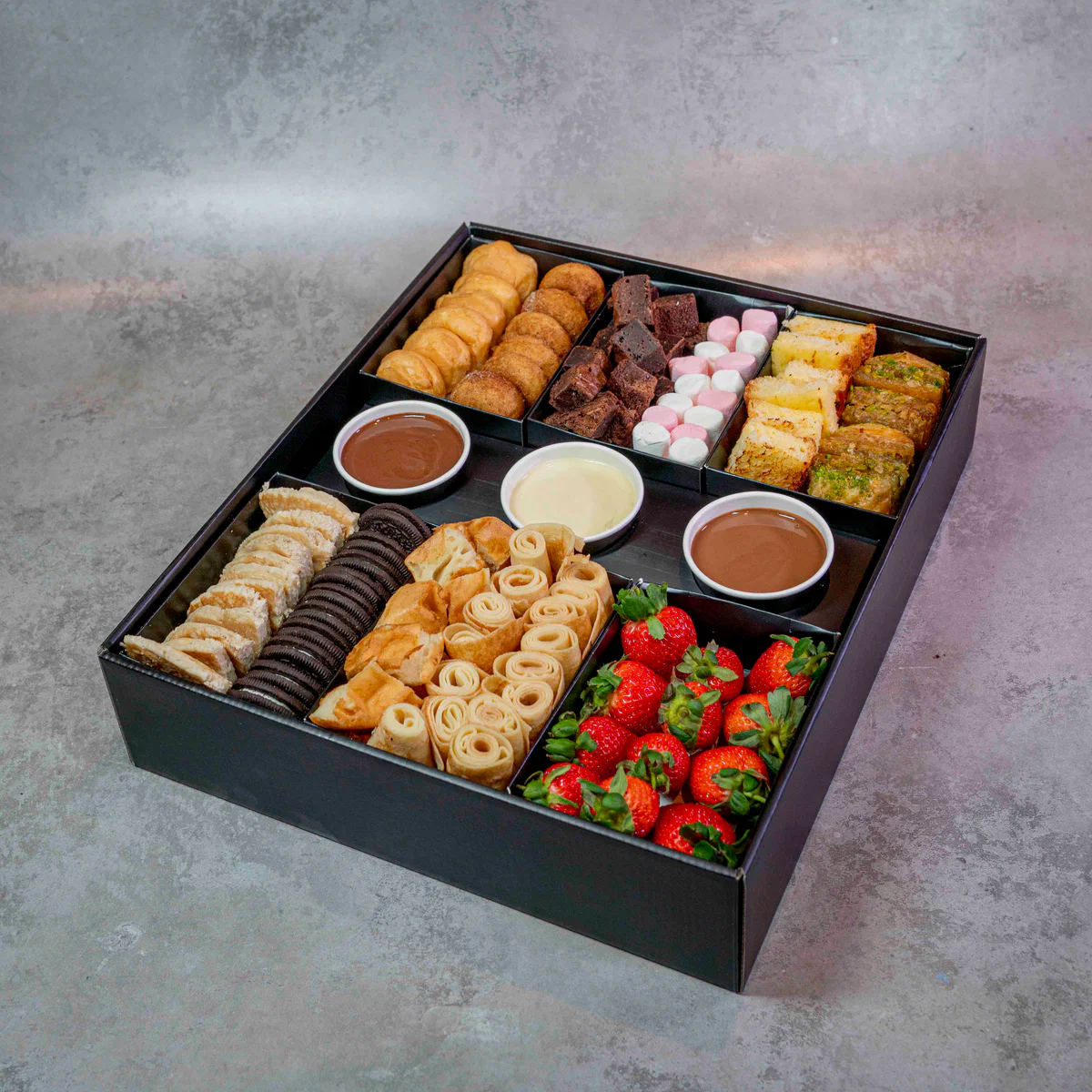 A dessert box with assorted premium baked treats.