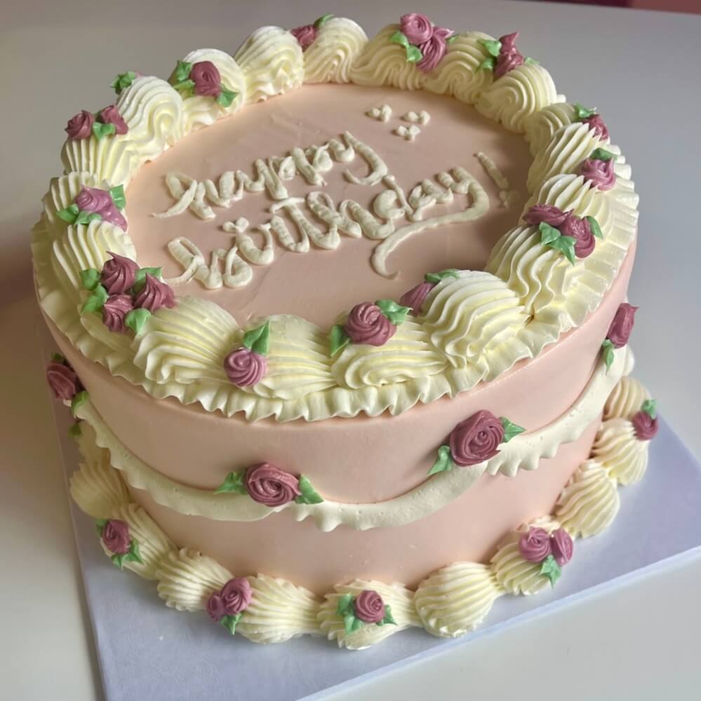 A decorated birthday cake in a premium celebratory presentation.