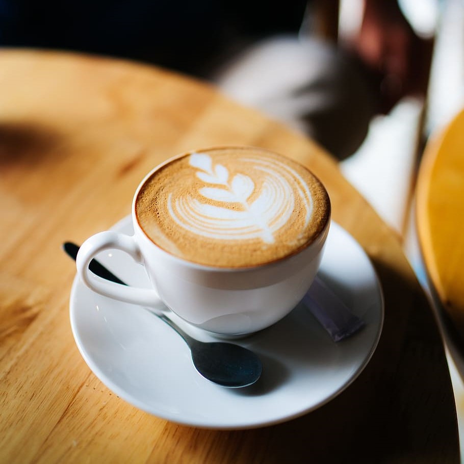 A cappuccino served in a premium mug with latte foam.
