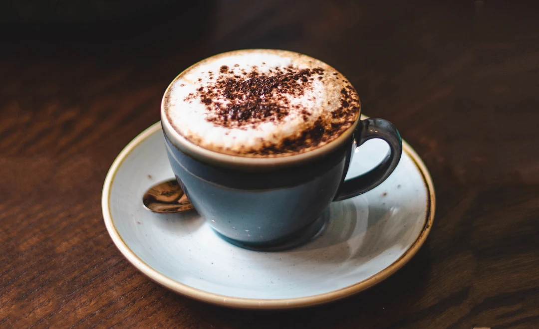 Coffee and a pastry arranged for a relaxed visit.