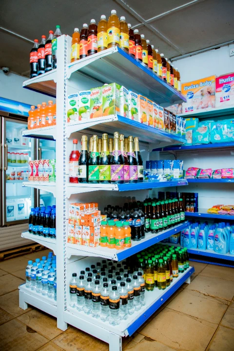 A clean supermarket aisle with organized products and premium lighting.