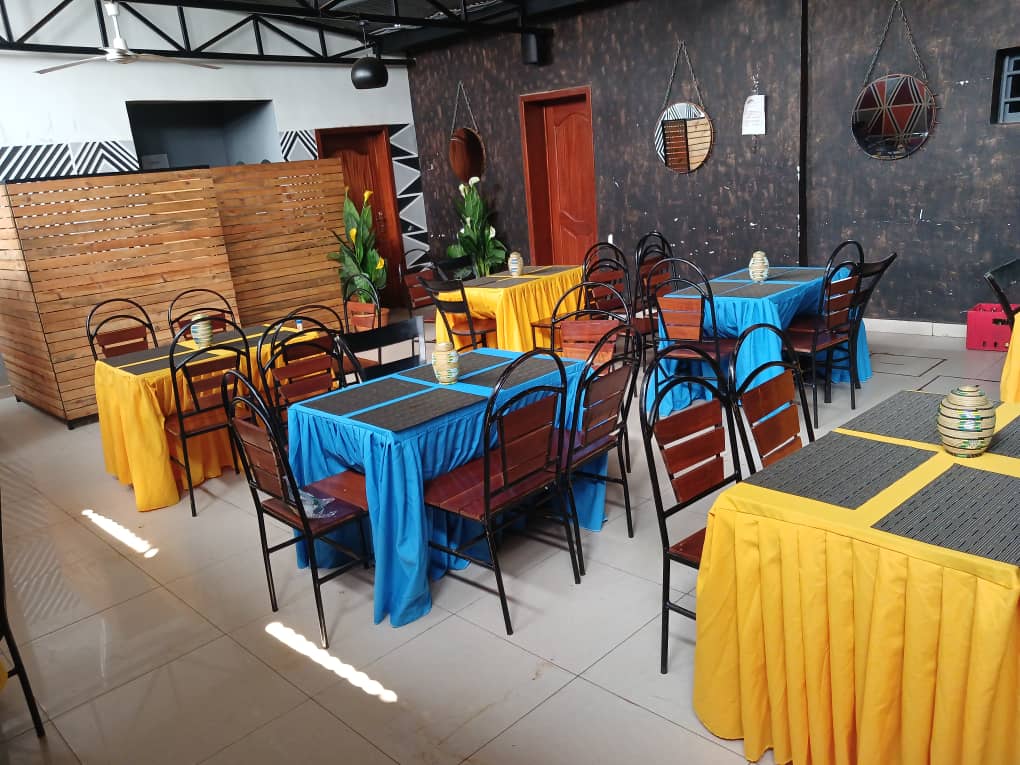 A premium restaurant interior with plated food and warm lighting.